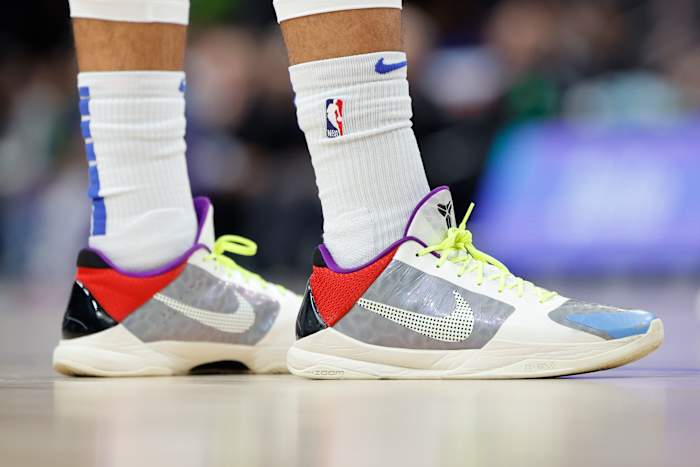 View of Jalen Brunson's grey and red Nike Kobe 5 basketball shoes.